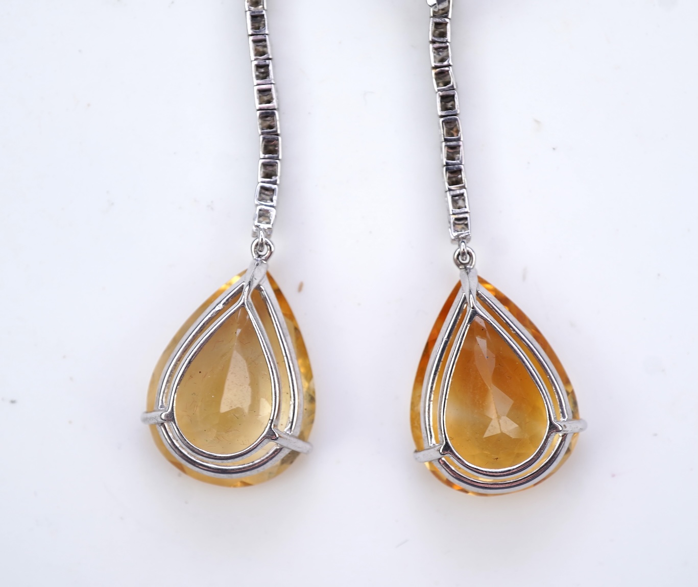 A pair of citrine and diamond earrings